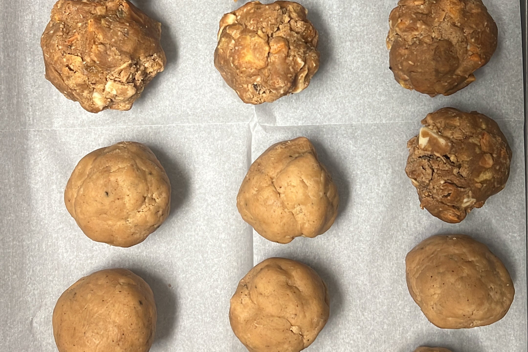 cookie dough on a parchment paper lined baking sheet